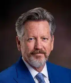 Arkansas Department of Commerce Hugh McDonald, profile photo, wearing a blue suit