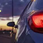 a photo of a car's brake light at dusk