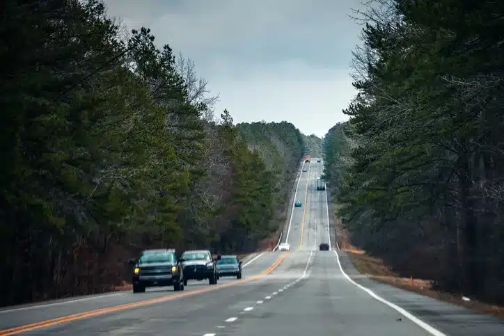 cars driving down a rural highway in Arkansas