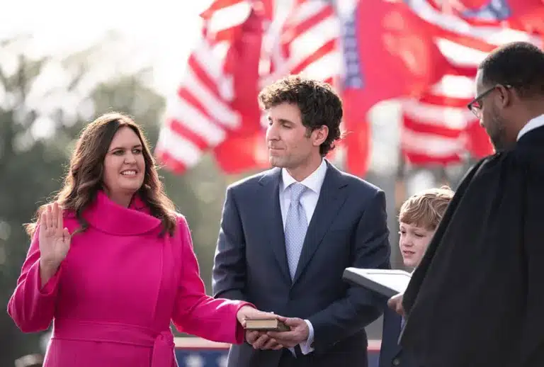Governor Sarah Huckabee Sanders being sworn in with her husband and children alongside her